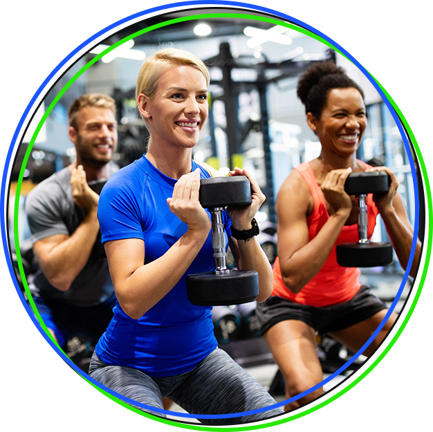 Fit People Working Out In Fitness Class At The Gym Stock Photo