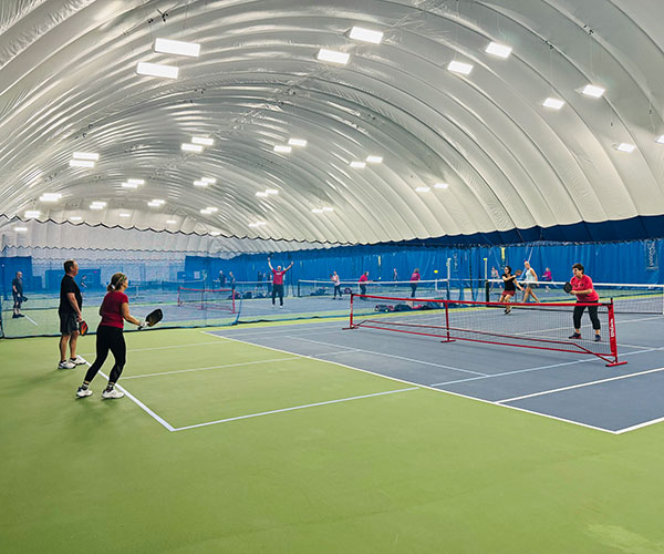 Players enjoy pickleball at StaFit Indoor courts